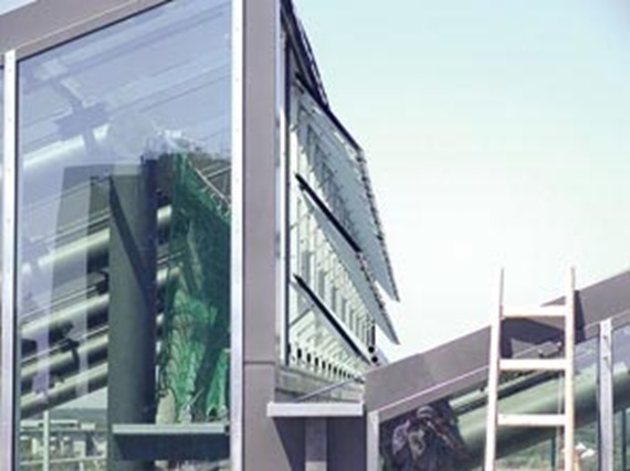 Plastic bushings in glass facade